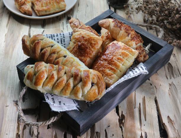 istock pile of bread on a wooden tray 1463682384