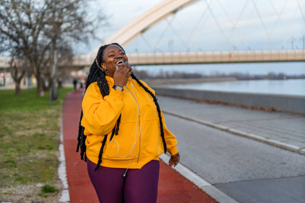 istock Young woman laughing outdoors. 1463684061