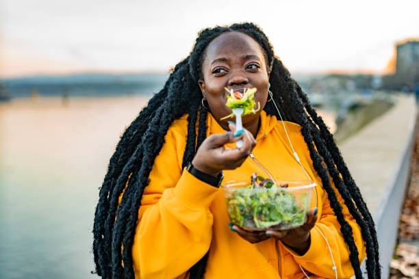 istock Beautiful active woman enjoying a salad 1463684090