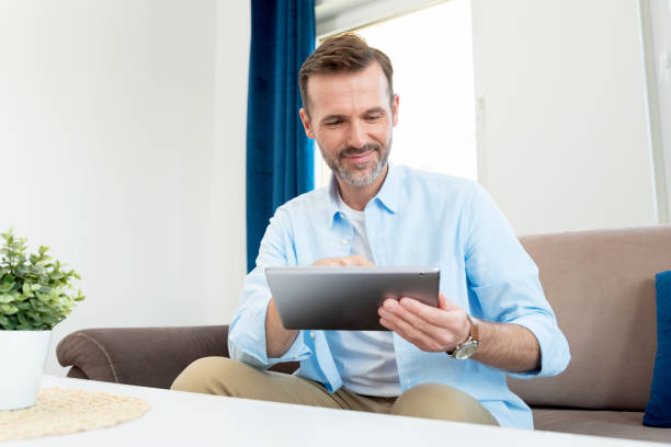 istock Handsome businessman working from home 1463684614