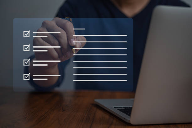 istock businessman checklist and document on virtual screens concept, business people check electronic digital questionnaire, evaluation, online survey, communication technology. 1463687722