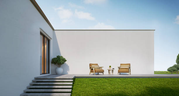 istock House living terrace with concrete wall background and armchairs.3d rendering 1463688494