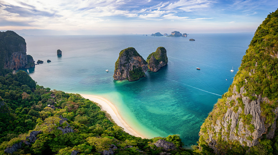 Aerial view through the lush jungle of Krabi of the beautiful Phra Nang Cave Beach without people, Thailand