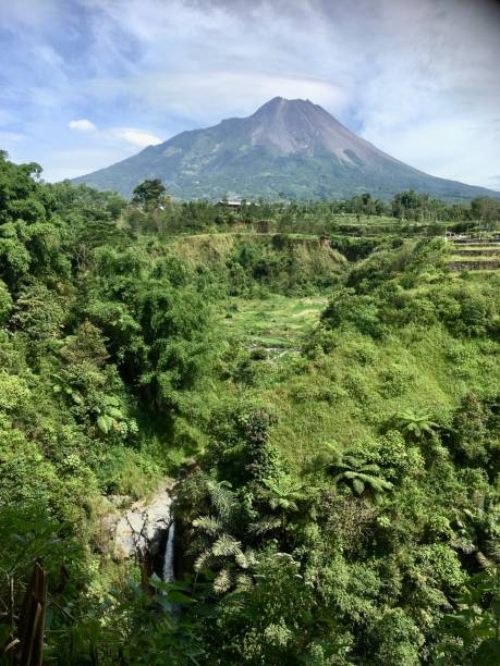 istock Beautiful view of waterfall and Merapi mountain 1463689031