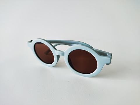 Blue sunglasses for kids isolated on white background, studio shot