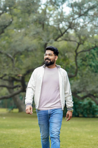 istock Young and confident indian man giving expression at park. 1463691730