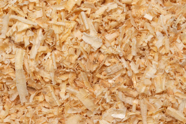 background of wood shavings background of wood shavings used as pet bedding. cutter insect repellant stock pictures, royalty-free photos & images