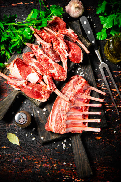 istock Raw rack of lamb with parsley on a cutting board. 1463695686