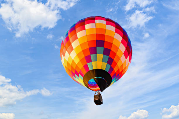 istock Hot air balloon flight over blue sky 1463700003