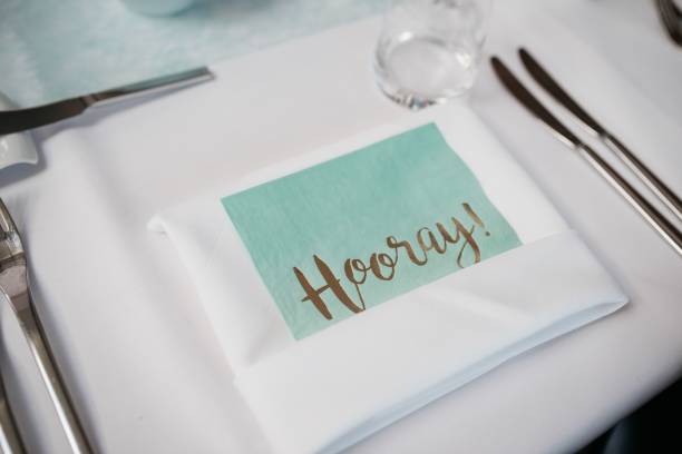 istock Wedding table interior with a white cloth napkin and silver knife 1463700363