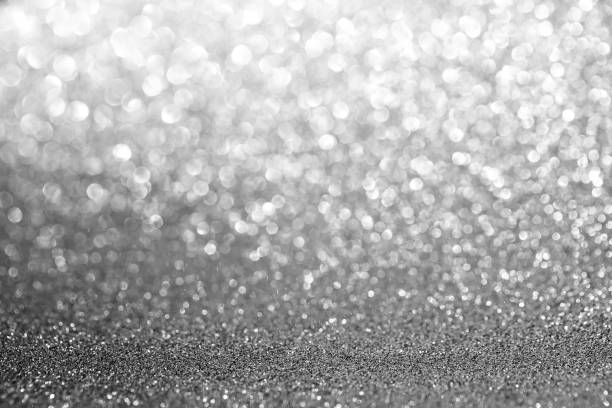 istock Beautiful silver bokeh lights background - great for wallpaper 1463701385