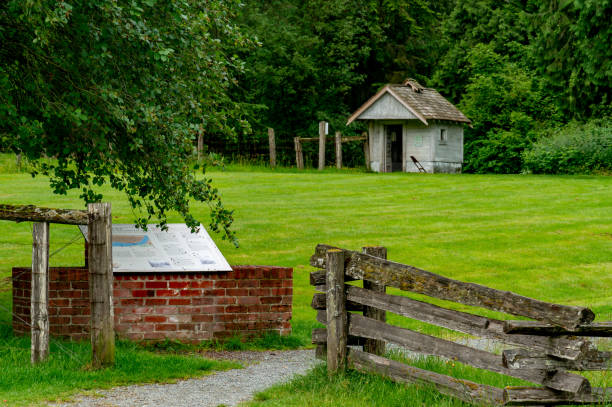 istock Small rustic building and a wooden fence by the forest 1463702185