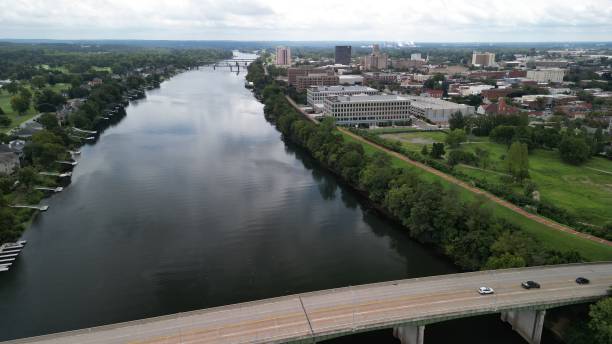 istock Bird's eye view of a river flowing between residential districts 1463703146