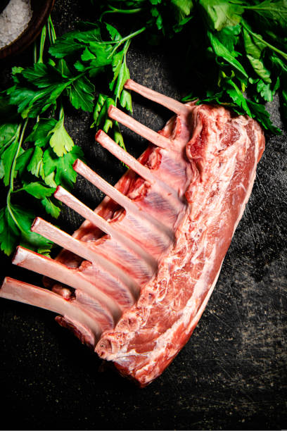 istock Raw rack of lamb with parsley. 1463703922