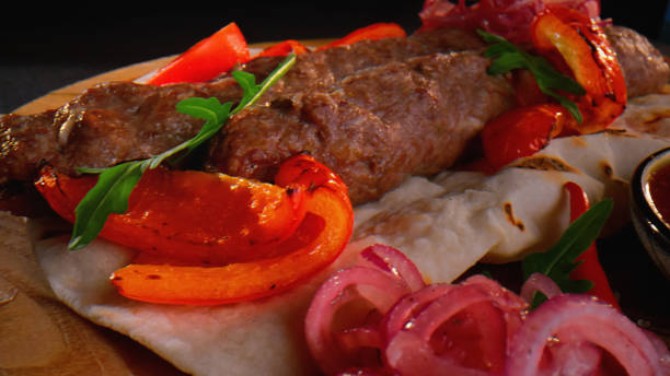 istock Kebab on a pita with red bell pepper, onion and tomatoes 1463707565