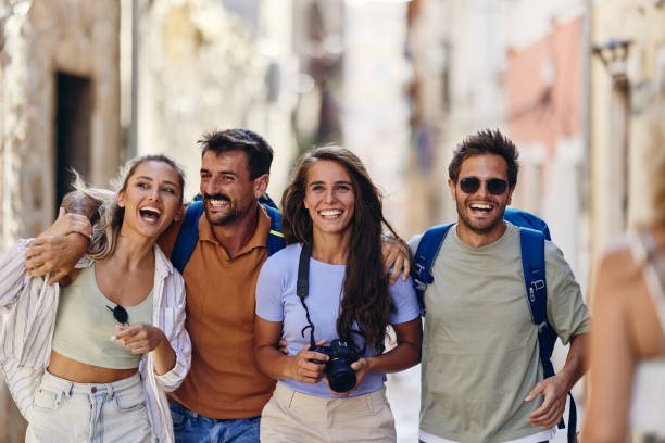 istock Cheerful tourists having fun while walking on the street. 1463708039