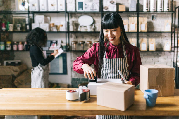 istock Small business owner sending a package to customer 1463708566