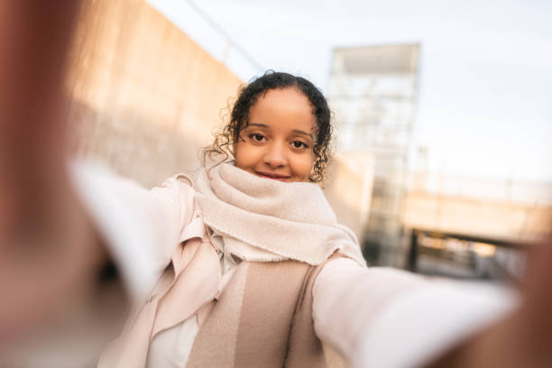 istock University student taking a selfie on her way home from campus 1463709189
