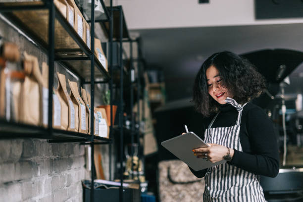 istock Small business owner checking her shop inventory 1463709983