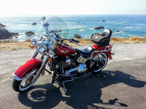 Bodega Bay, United States – October 11, 2022: The Softail Deluxe 2012 motorcycle of Harley Davidson sitting on the West coast