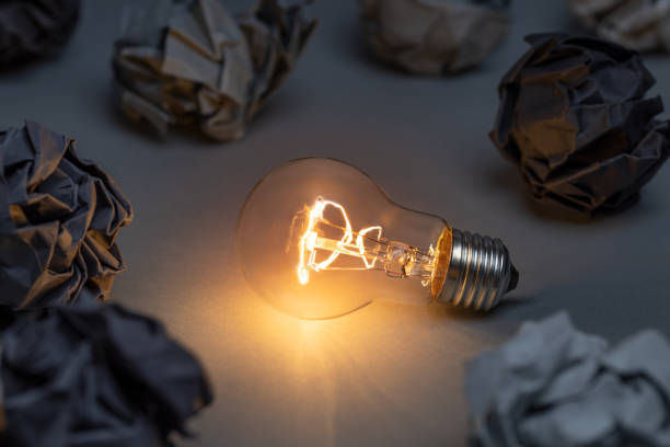 istock Idea concept with classic light bulb glowing in the dark 1463713582