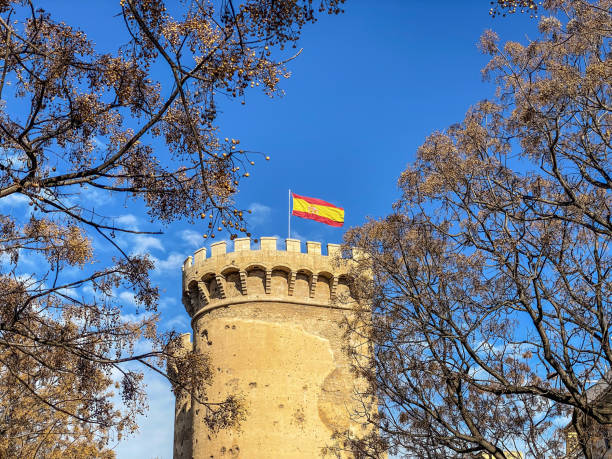 istock Spanish flag waving on top of medieval tower 1463723143