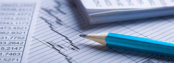 istock Checking the value of securities. Pencil, share listing and checking financial chart. Concept of banking, financial report and financial audit. 1463723238