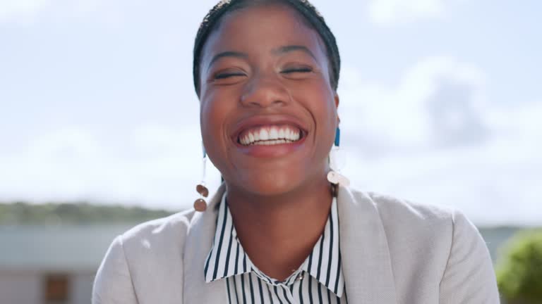 Face, funny or business woman on rooftop laughing at joke or relaxing in Kenya with career goals or mission. Happy, black woman or portrait of African employee on break with positive mindset to relax