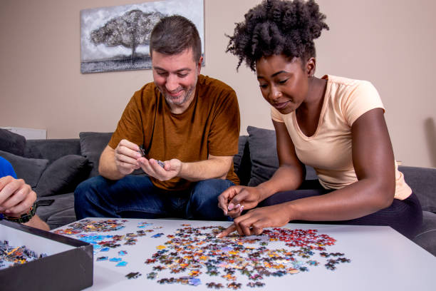 istock A couple playing jigsaw puzzle at home. 1463724008