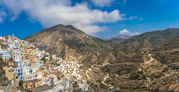 Panorama of the hillside colorful homes in the old tradition village Olympos in Karpathos island, Dodecanese Greece