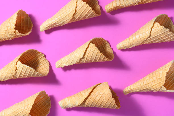 istock Top view of fresh ice cream cones on a pink surface 1463726986