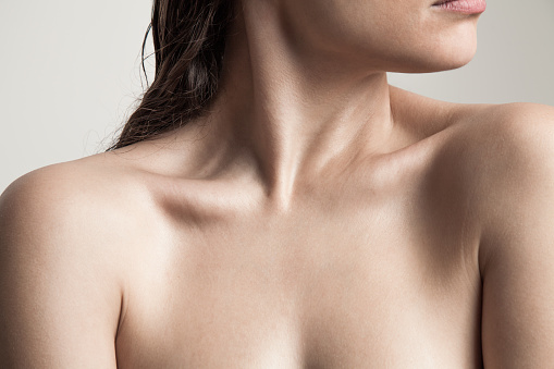 close up of woman neck and shoulders natural beauty skin studio shot