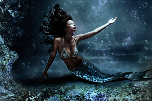 istock Beautiful mermaid in an underwater scene 1463728485