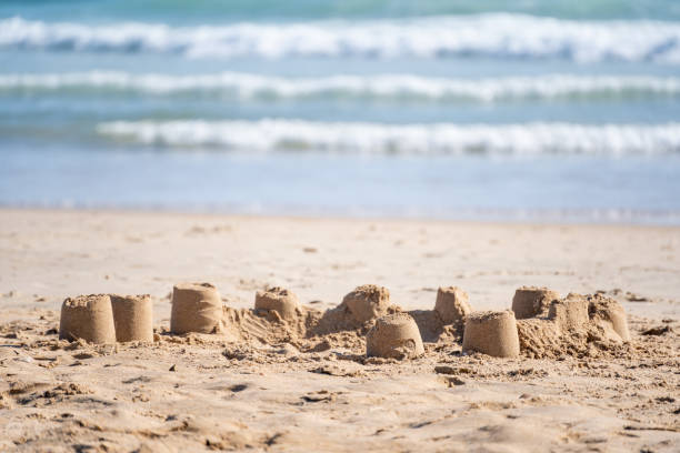 istock Small sand castles on the sandy beach on the coast 1463729953