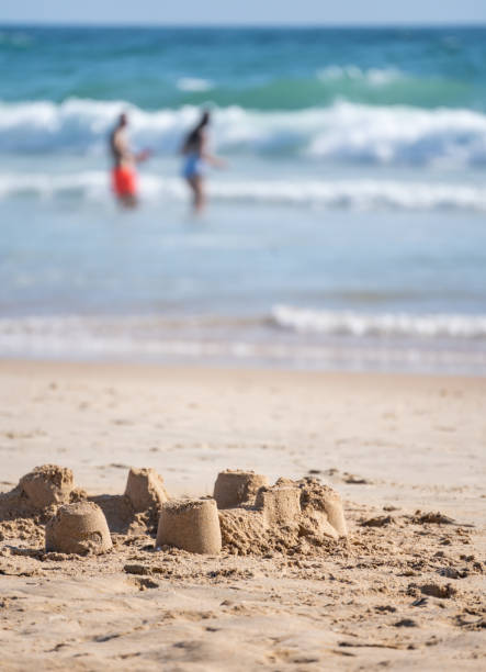istock Small sand castles on the sandy beach on the coast 1463729980
