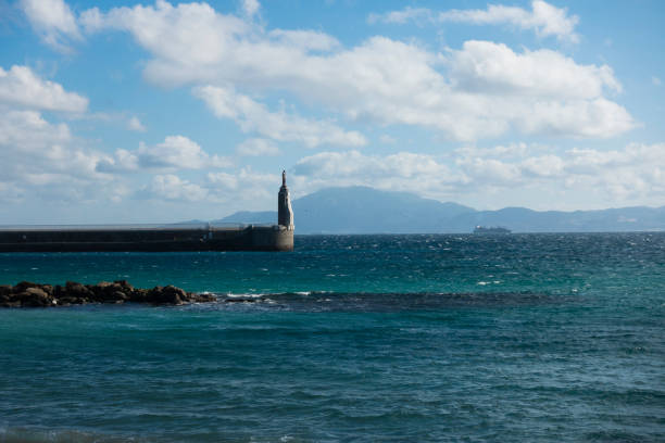 The statue of Jesus Christ at the entrance of the port of Tarifa, Spain. Strait of Gibraltar.