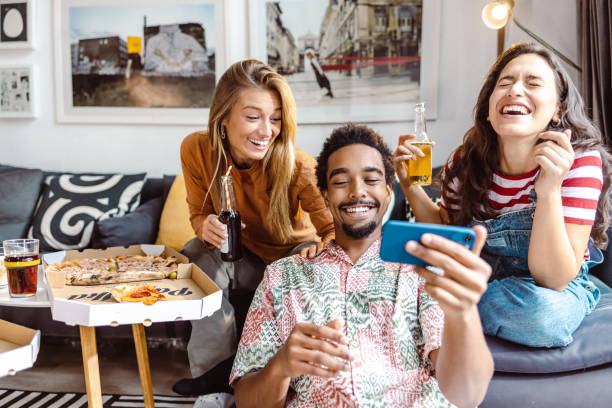 istock Multiethnic group of friends taking selfie at home 1463732841