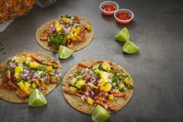 istock Tacos with wedges of lime and ketchup on a black surface 1463733463