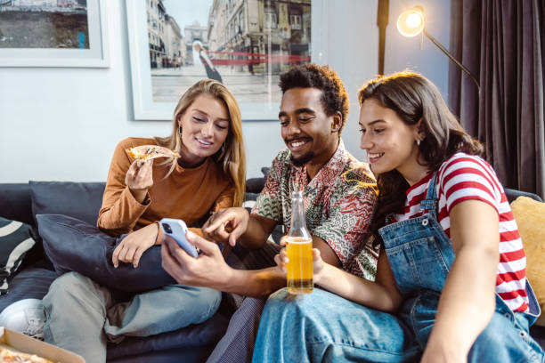 istock Multiethnic group of friends taking selfie at home 1463733601