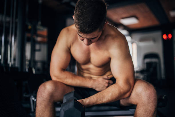 istock Shirtless man training in gym 1463735221