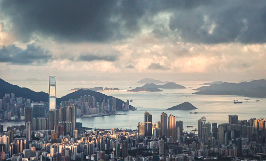 An aerial panoramic beautiful cityscape of Hong Kong under the cloudy blue sky in China