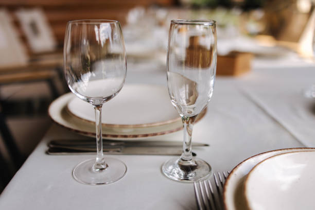 istock Table setting, beautiful white plates, silver cutlery and crystal glasses. Outdoor feast on holiday. Party 1463736617