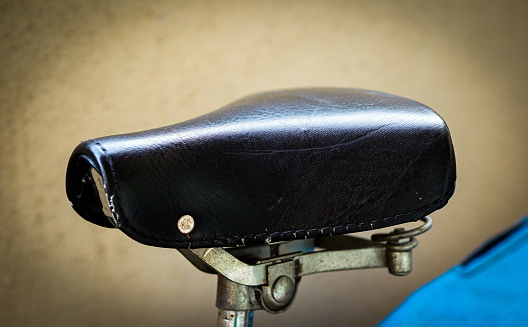 A close-up shot of black bicycle seat