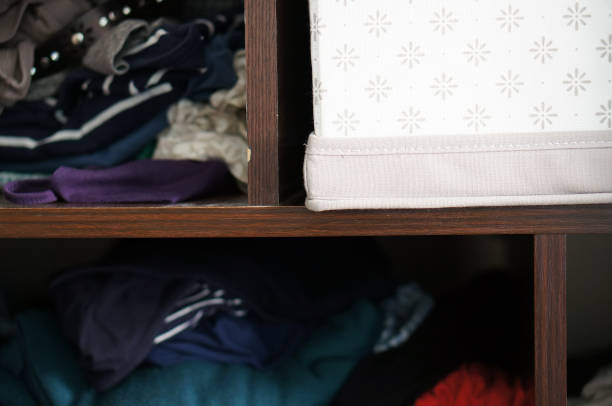 istock Wooden cabinet with disorganized clothes 1463738664