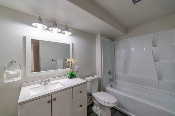 istock Mirror, a sink, and a bath in a bathroom 1463744621