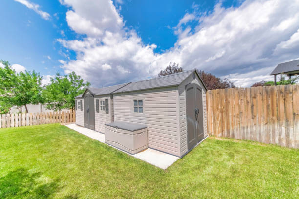 istock Small fenced shed or storage with a green field 1463744661