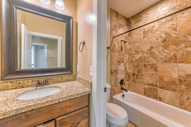 istock Mirror, a sink, a toilet seat and a bath in a bathroom 1463744678