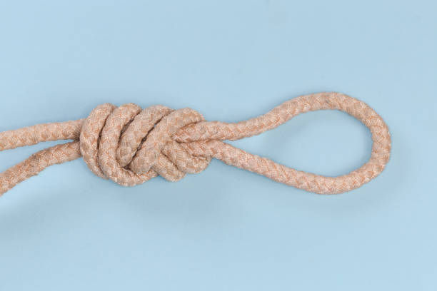 istock Rope knot Figure-nine loop on blue background close-up 1463744724
