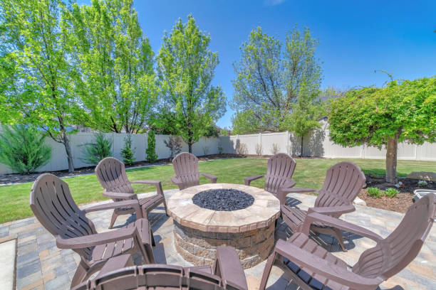 istock Round stone table with plastic chairs in front of the house 1463744745