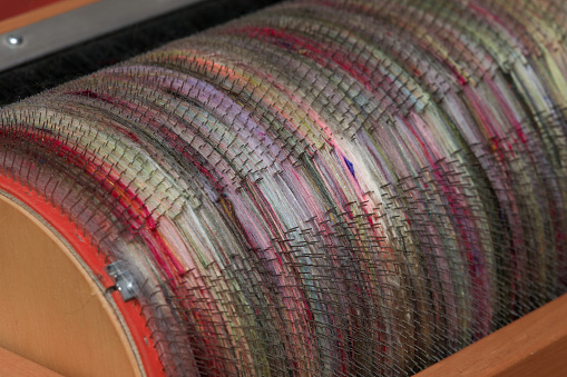Detail of a drum carding machine for fibre processing